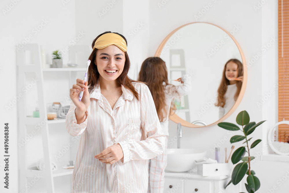 Sticker young woman with sleeping mask and toothbrush in bathroom