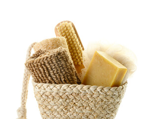 Wicker basket with different bath supplies on white background, closeup