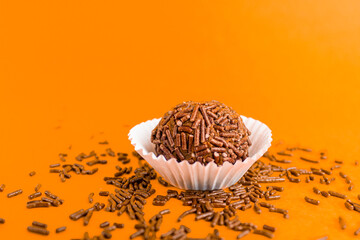 Brigadeiro isolated on orange background