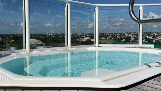 An outdoor sundeck hot tub on a cruise ship for the suite guests.