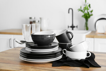 Set of clean tableware in  kitchen