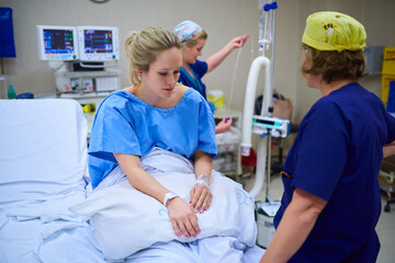 Preparing the final stages before surgery. Shot of a young pregnant woman sitting on her hospital...