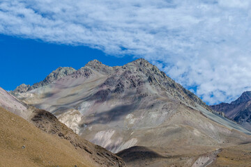Grey mountain peaks at Valle de Colina, Cajón del Maipo at San Miguel in Chile,  a popular tourist destination.