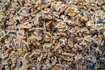 many brown peeled together walnuts