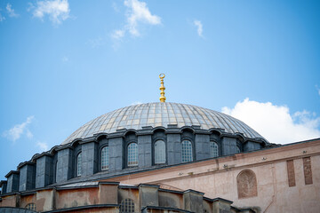 Fototapeta na wymiar Golden peak of turkish temples in istanbul city in turkia