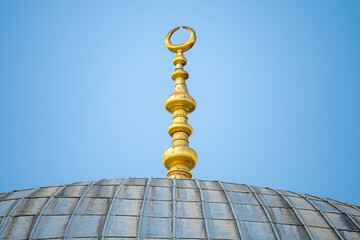 Fototapeta na wymiar Golden peak of turkish temples in istanbul city in turkia