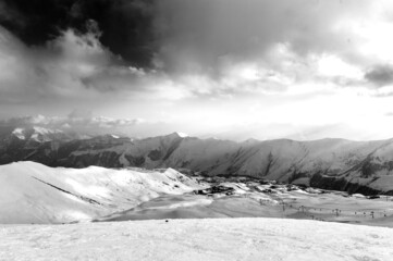 Snowy winter mountains in sun day. Georgia, from ski resort Gudauri.