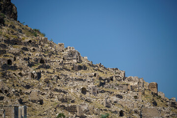 Houses carved into the rocks of the mountain in the area of Cappadocia in Turkey