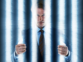 The finality of white collar crime. Cropped shot of a businessman behind bars.
