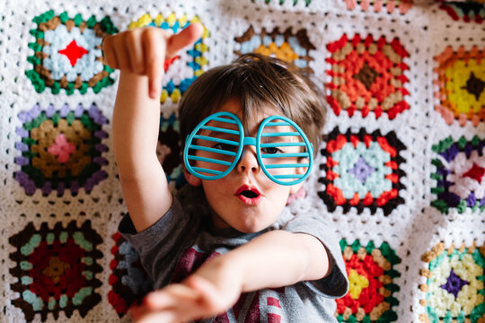 young boy wearing easter egg glasses