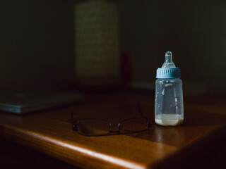 empty baby bottle on table in home 