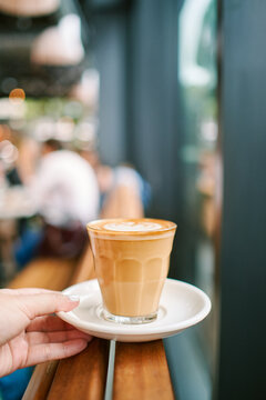 holding a latte