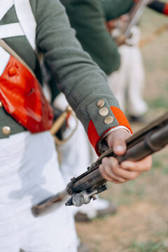 Soldiers with a gun in their hands. Closeup photo.