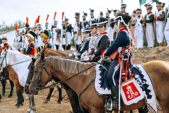 A man in a uniform on a horse