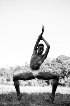 Black and white portrait of male dancer in nature