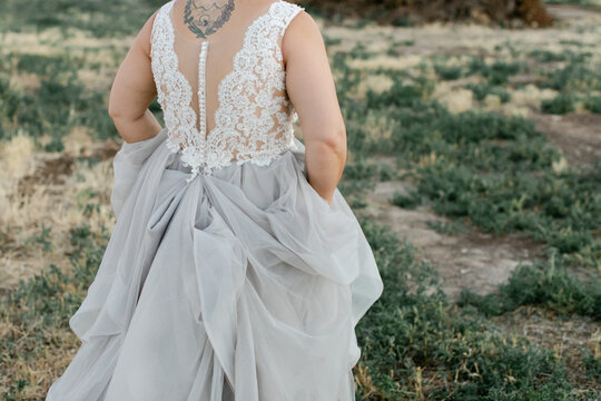 Anonymous Portrait of Bride Walking in Field