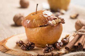 Baked apples, with honey inside. And walnut and cinnamon. Healthy diet food.