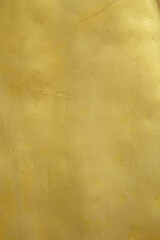 background of old plaster wall with gold paint
