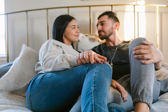 Young couple in love relaxing in bed