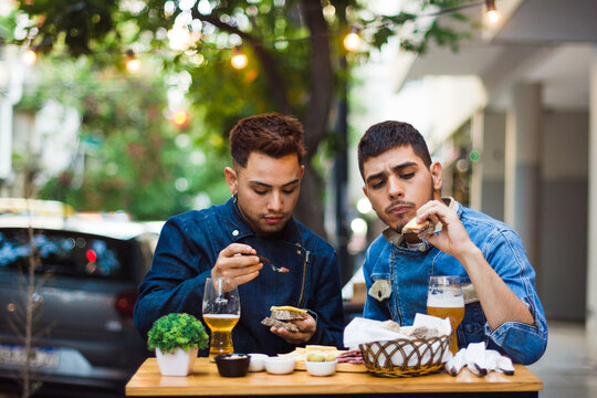 Gay latino couple on a date outdoors