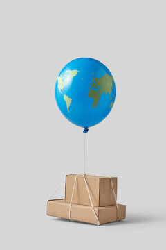 Cardboard boxes tied to earth shape balloon