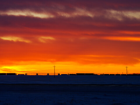 train stoped on prairie in sunset