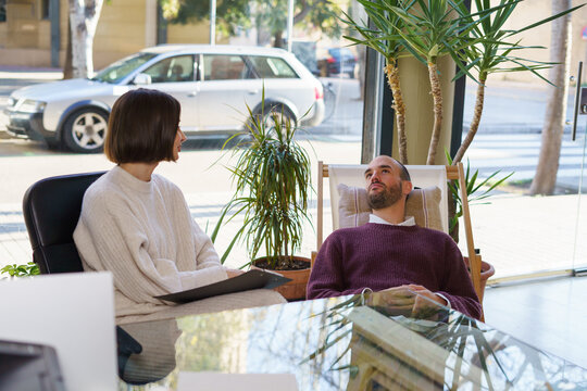 Man lying in deckchair in sexologist office