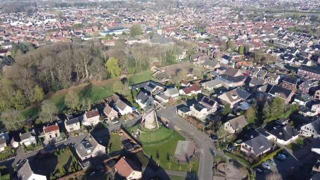 Aerial view village Sprundel in Netherlands with windmill Molenerf and clear blue skies and churches