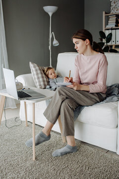 Woman consults remotely with doctor on laptop