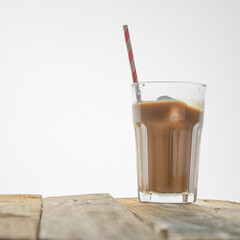 Iced coffee on a white background, with copy space. Cool summer drink