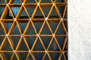 Triangular frame in front of frosted window