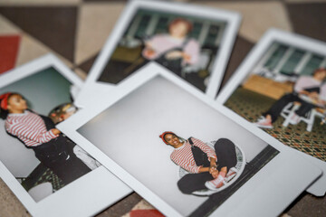 Instant photos of black painter in workshop