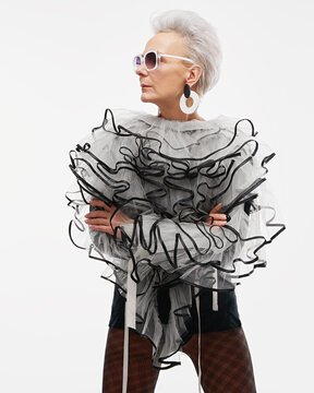 Elderly woman wearing extravagant clothes,