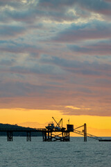 Fototapeta na wymiar Kitsilano Pier Sunset English Bay. Sunset over English Bay and the Kitsilano pier. Vancouver, British Columbia.
