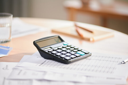 Calculator and documents on table