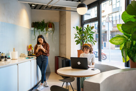 Businesswoman Sitting Around The Desktop In The Office.