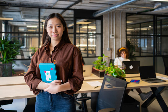 Portrait Asian Entrepreneur In A Coworking Office. 