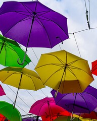 Beautiful, bright colorful multi colored umbrellas hanging overhead in San Diego, California