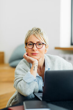 Woman Using Laptop at Home
