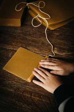 Women rolling honeycomb sheets