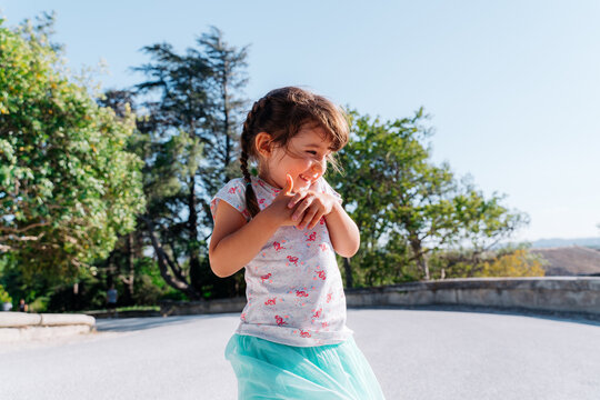 Happy little girl smiling outdoors