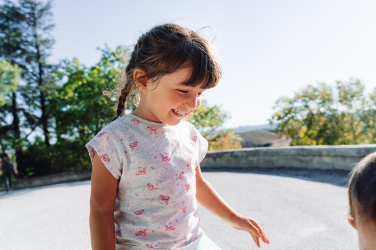 Happy little girl smiling outdoors