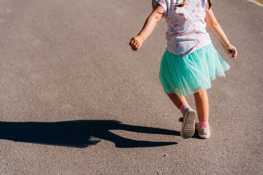 Little girl dancing in the street