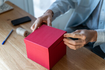 Man boxing present on kitchen countertop