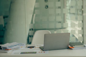 financial graph document on the desk of businesspeople analyze investment charts with laptop in-office accounting