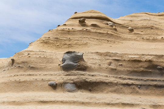 Mountain with layers of sand and rocks