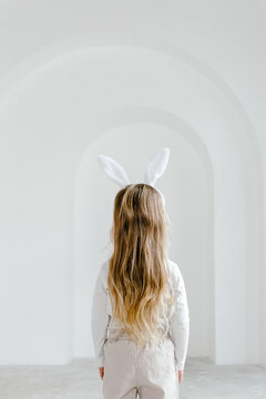 Girl in bunny ears in studio
