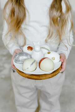Crop child with Easter eggs