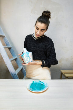Female Potter With Final Glazed Products