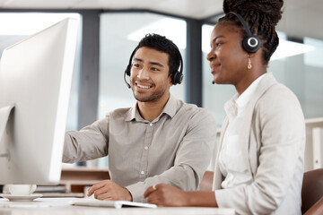 Your attitude determines how well you do it. Shot of two colleagues working in a call center.